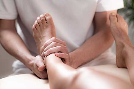 Doctor examining arthritic foot